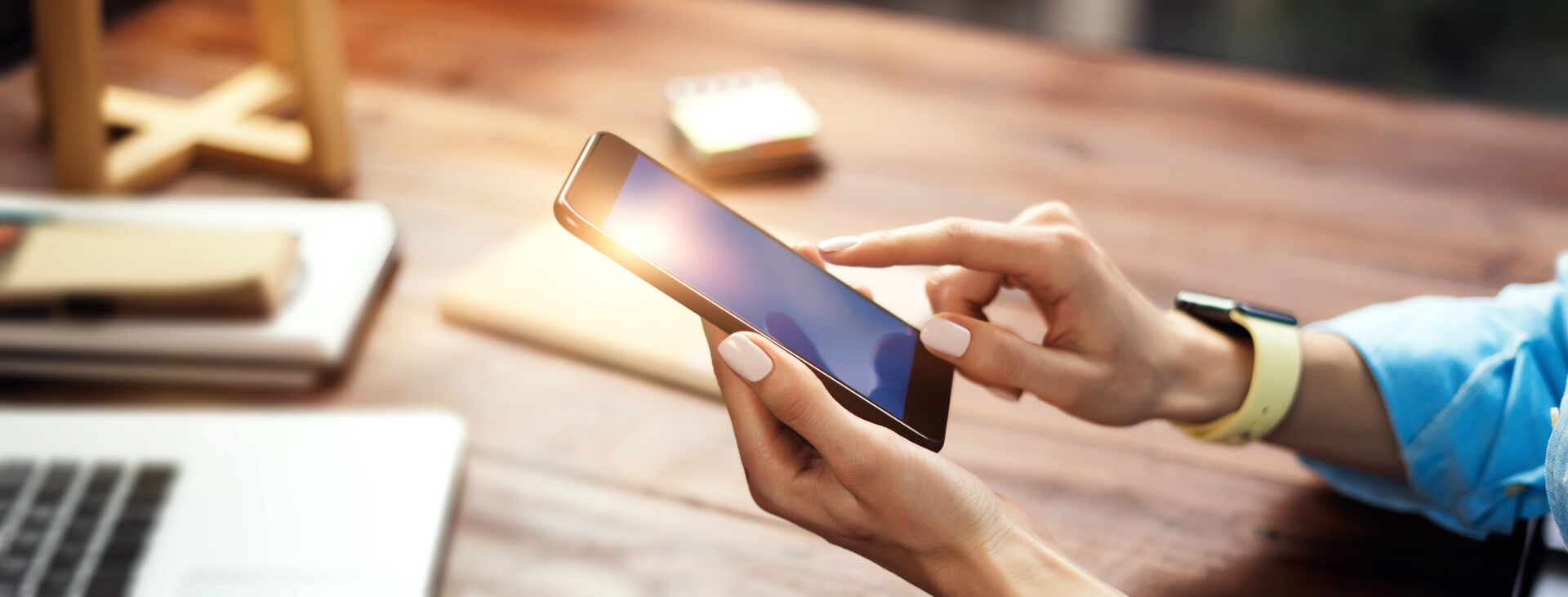 Woman pointing on smartphone screen, chatting in social networks, meeting website, searching internet, sending sms, using text messenger or online banking. Close up of female hands with mobile phone