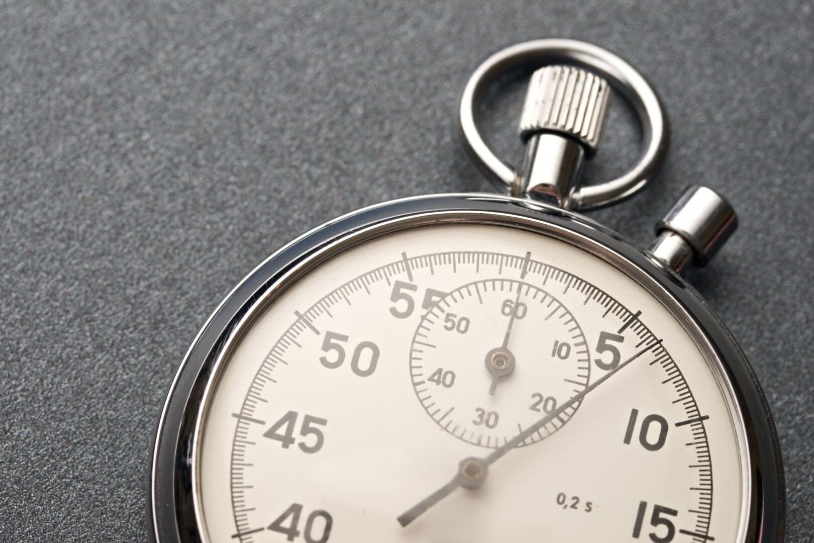 Stopwatch on the grey background