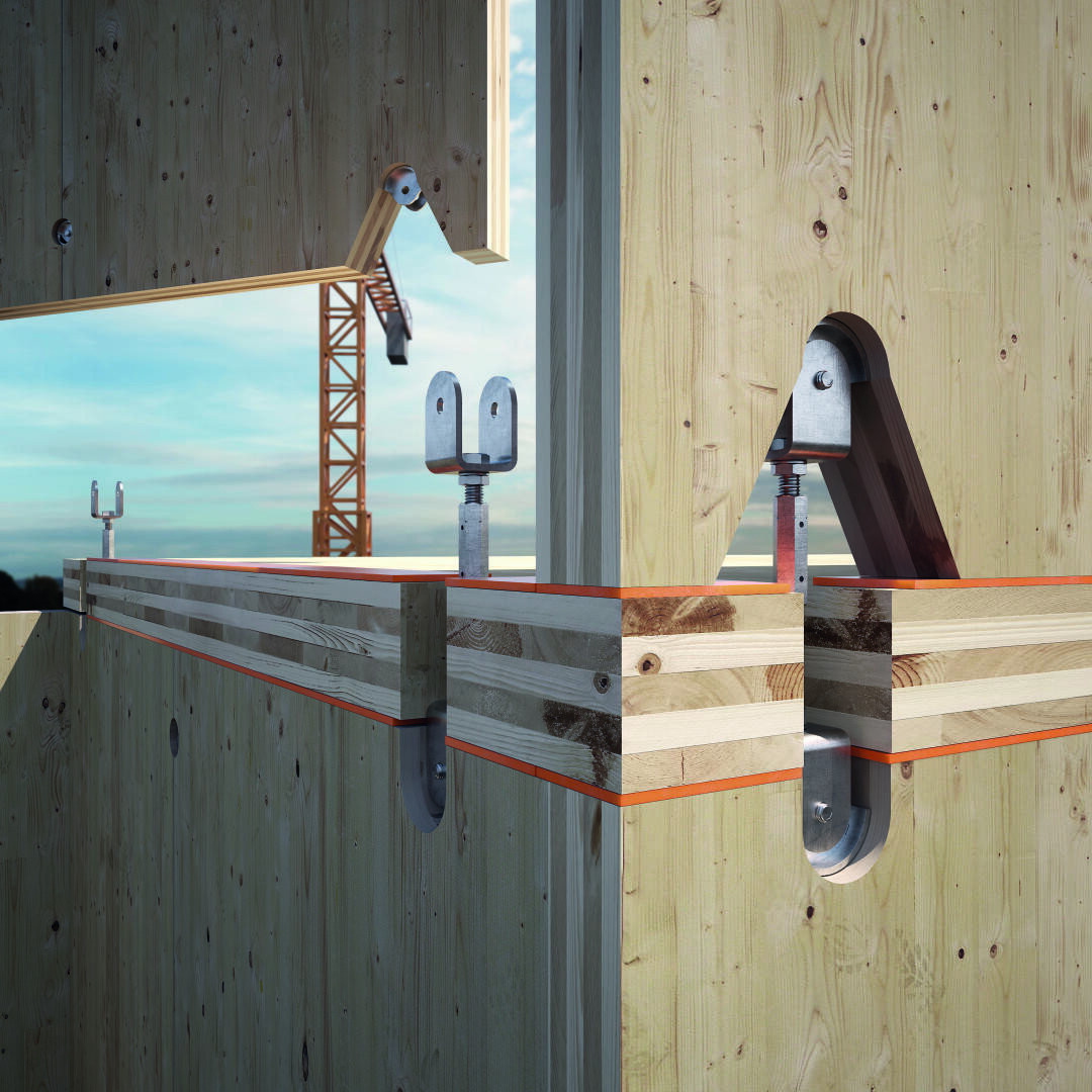 Gros plan sur des panneaux de mur et de sol en bois lamellé-croisé, reliés par des connecteurs métalliques. En arrière-plan, on aperçoit une grue de chantier sur fond de ciel bleu.
