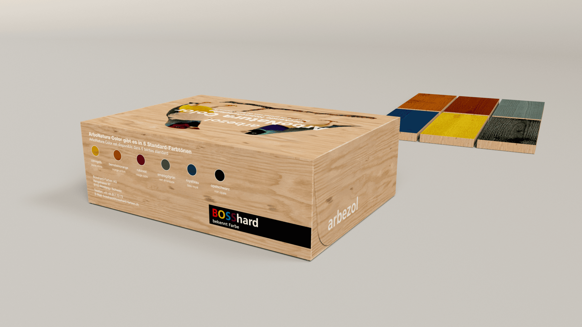 Sur une surface claire se trouve une caisse en bois portant les inscriptions BOSshard et arbazol, avec des points de couleur et des descriptions sur le côté. À côté se trouvent six carreaux de bois, chacun peint dans une couleur différente.